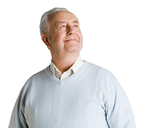 An older man smiles warmly