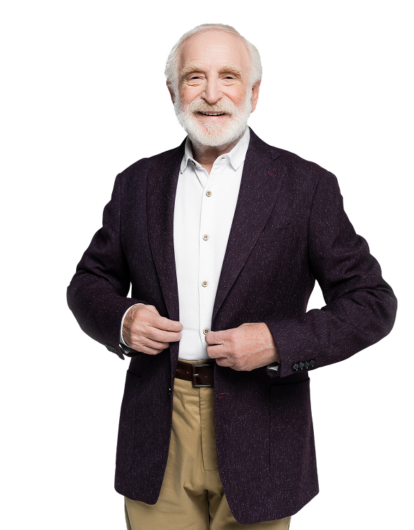 An older man in a suit smiles