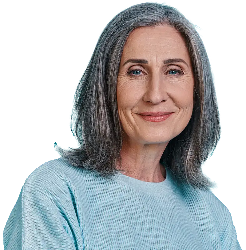 An older woman with shoulder-length gray hair smiles softly at the camera.
