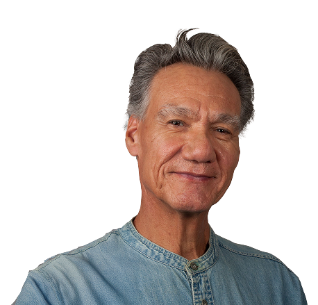 man_denim_shirt A smiling man wearing a blue shirt.